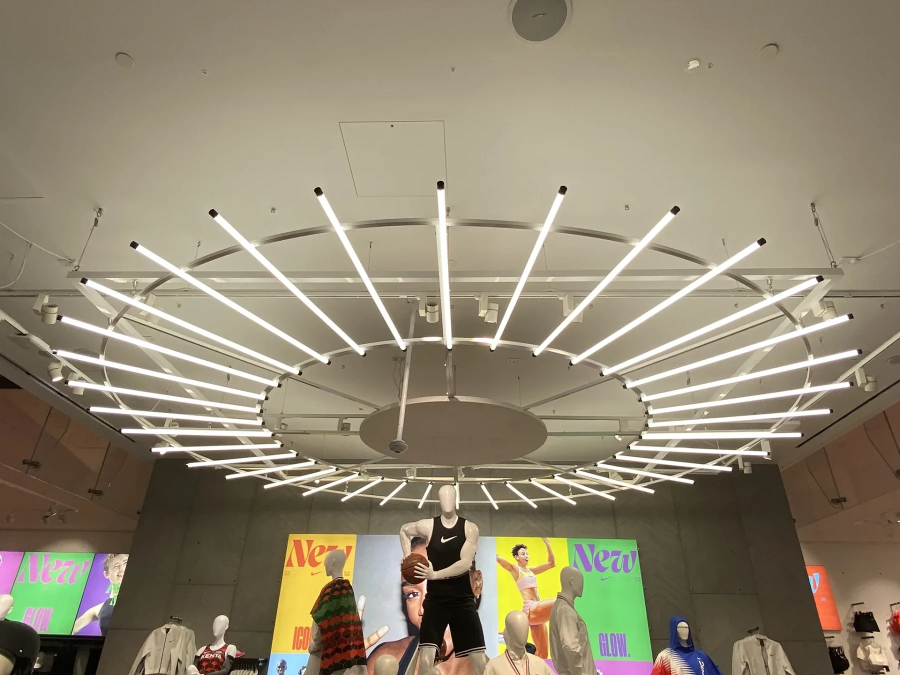 The same circular luminaire in its standard white-light setting, changed without replacing the fitting.