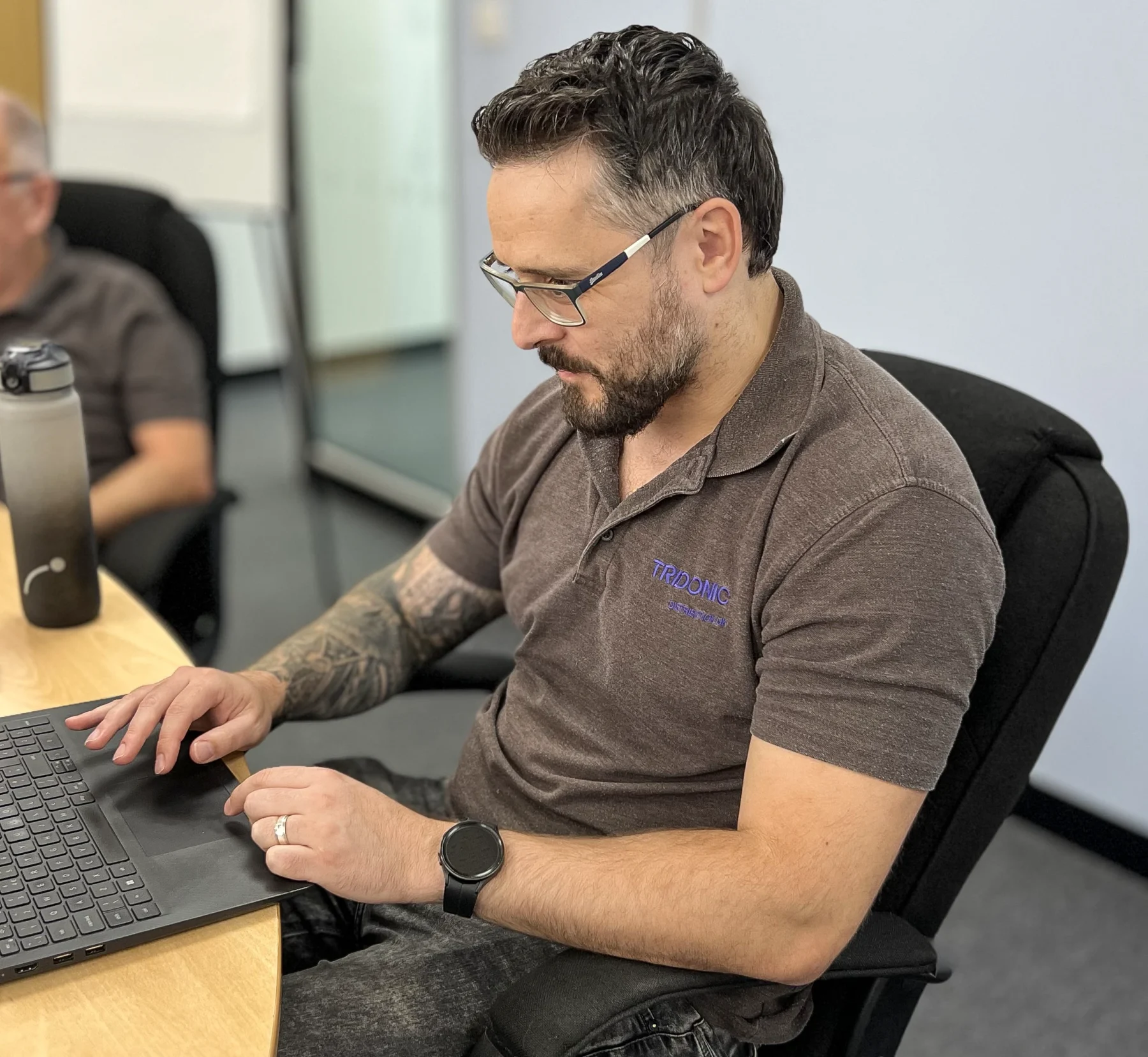 Tridonic Distribution UK team member working through a lighting specification on a laptop